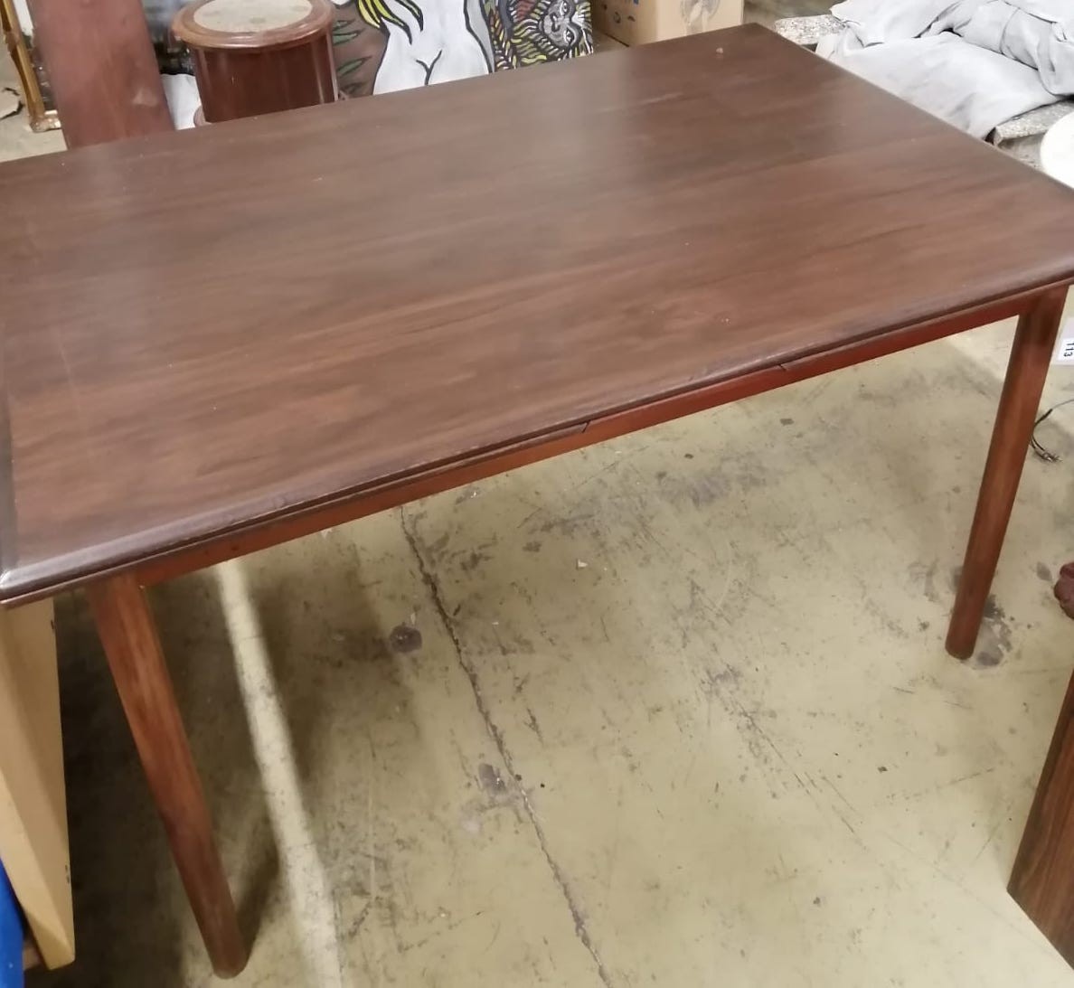 A mid century Danish rectangular teak extending dining table (label underneath), length 124cm, width 85cm, height 73cm